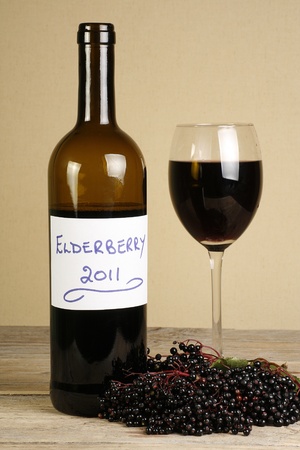 bottle of home made elderberry wine and glassの写真素材
