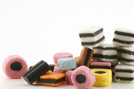 stack of colourful candy on a white backgroundの写真素材