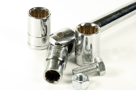 ratchet spanner nut and bolt isolated on a white backgroundの写真素材