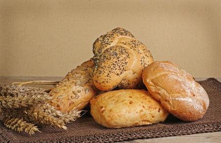 selection of rustic bread on a wooden tableの写真素材
