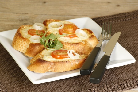 tasty grilled cheese on toast on a wooden tableの写真素材