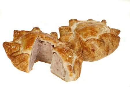 two home made pork pies on a white backgroundの写真素材