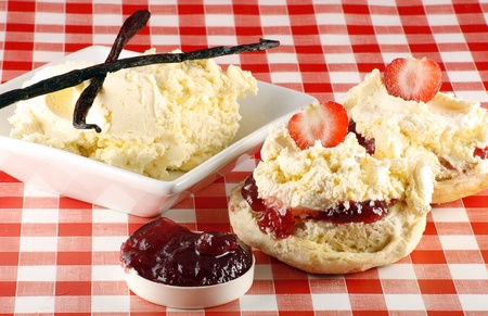 split strawberry cream scone, with cream and jamの写真素材