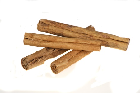 whole spices cinnamon sticks isolated on a white backgroundの写真素材