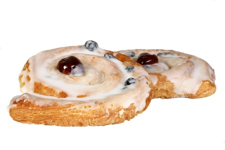 danish pastries iced raisin and cinnamon isolated on whiteの写真素材