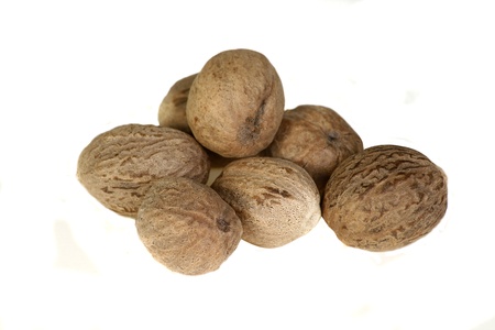 whole spices nutmeg isolated on a white backgroundの写真素材