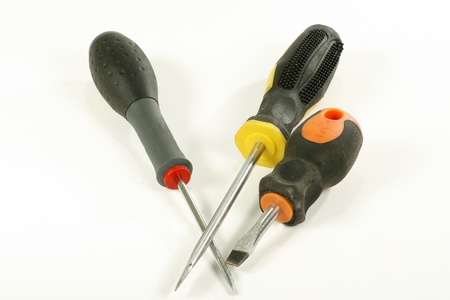 three assorted screwdrivers on a white backgroundの写真素材