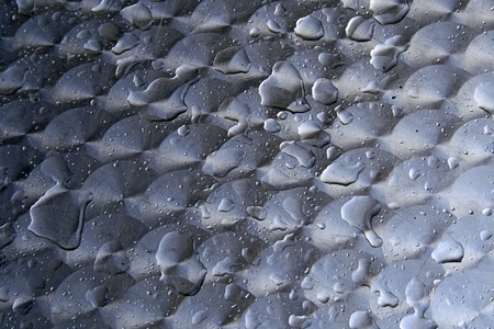raindrops on aluminium table topの写真素材