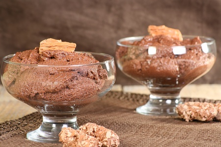chocolate dessert in a glass bowl on wooden tableの写真素材