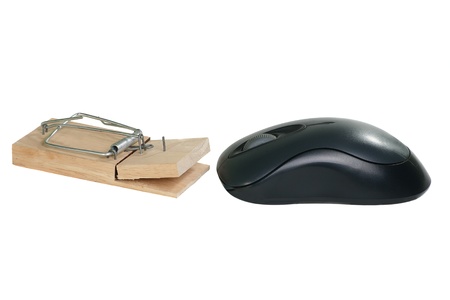 black computer mouse and wooden mousetrap on a white backgroundの写真素材