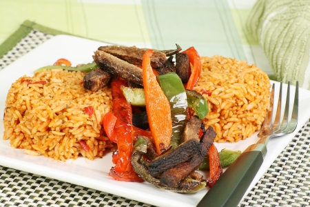 steak strips and sweet peppers with piri piri riceの写真素材