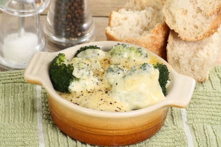 Vegetarian broccoli and cauliflower cheese bake in a rustic bowlの写真素材