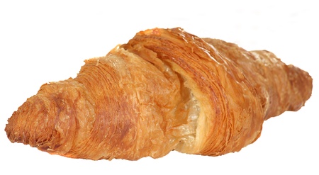 Single fresh baked butter croissant isolated on a white backgroundの写真素材