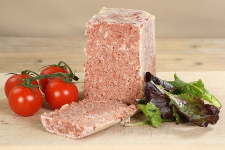 corned beef from a can with tomato and salad garnishの写真素材