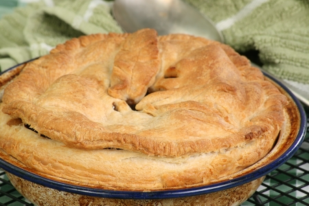 Home baked steak and kidney pie cooling on a rackの写真素材
