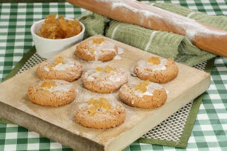 home made stem ginger biscuits with icing and diced gingerの写真素材