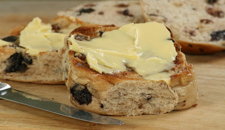    Toasted hot cross bun spread with butter                            