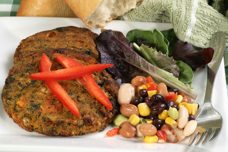  vegetarian lentil and spinach burgers wit four bean salad                              の写真素材