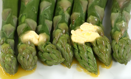  asparagus spears close up with melted butter                              の写真素材