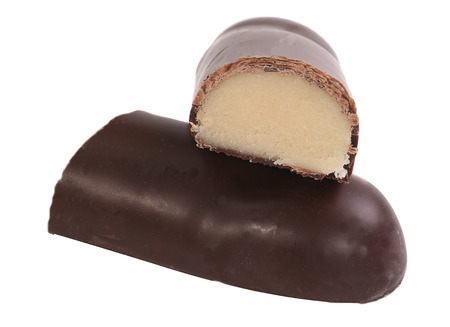 marzipan bar coated in dark chocolate isolated on whiteの写真素材