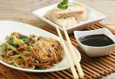 teriyaki salmon flakes with rice wine noodles and vegの写真素材