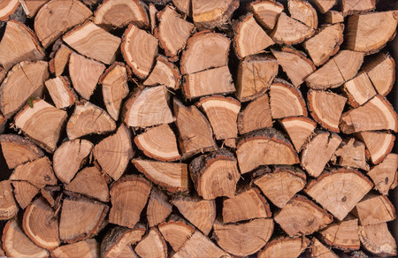 Wooden logs, beams, firewood. A lot of wood. Wooden log wooden background. Fuel. Harvesting firewood for the winter.の写真素材