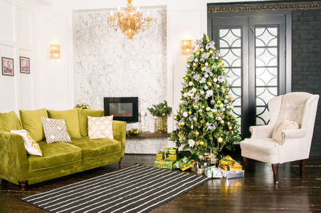 interior photo studio with christmas decor. Fireplace, Christmas treeの写真素材