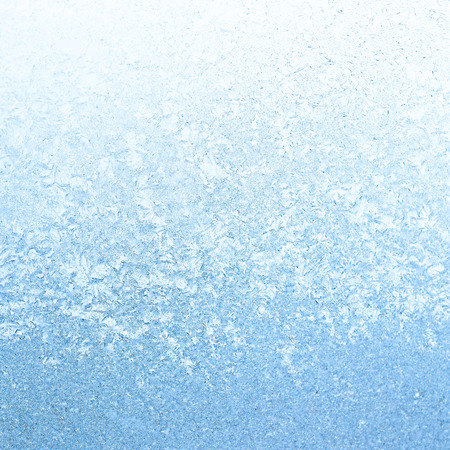 Frosty winter background photo of ice buildup on a windowの写真素材