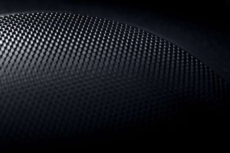 Abstract macro photo of a black speaker grilleの写真素材