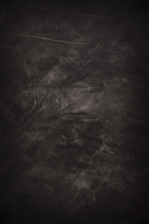 Dark rough grunge painted abstract black art backgroundの写真素材