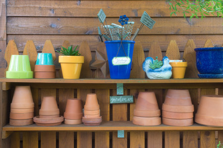 A well-kept outdoor gardeners potting table, ready for you to work.の写真素材