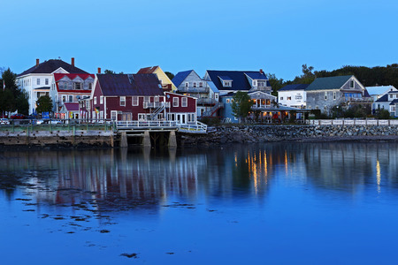 Twilight reflections of buildings and lights on waterfront at Saint Andrews, New Brunswick, Canada.のeditorial素材
