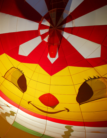 A smiling face inside a hot air balloon as it inflates at the 30th annual Atlantic International Balloon Fiesta in Sussex, New Brunswick, Canada, Sept. 12, 2015.のeditorial素材