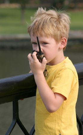 A child talking on a walkie talkie.の写真素材