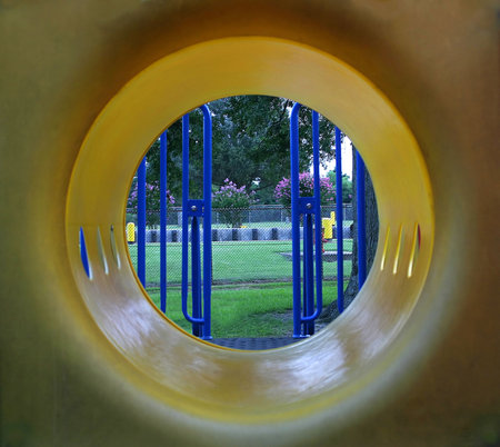 An abstract view of a tunnel on a piece of playground equipment.の写真素材