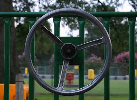 A steering wheel on a piece of playground equipment.の写真素材