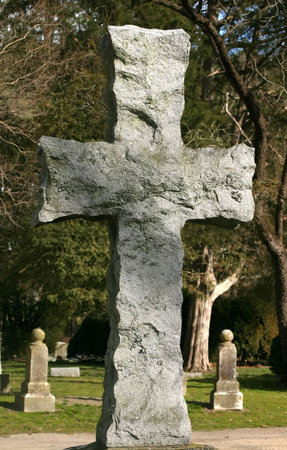 An old stone carved cross in a cemetery.の写真素材