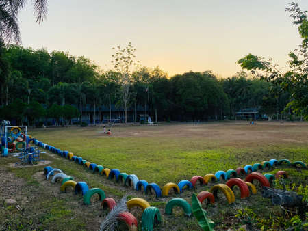 Colorful playground on yard in primary school, outdoor sports playground for kids, recreation and development outside, children's playground or yard.の写真素材