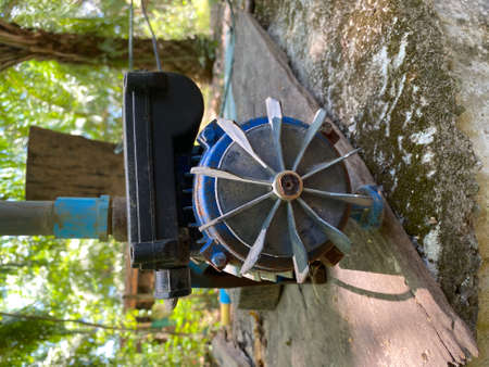 The close up of old water pump motor groundwater drainage system pumps water out of the ground. Solve the drought in Thailand.の写真素材