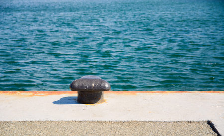 A black bollard for mooring