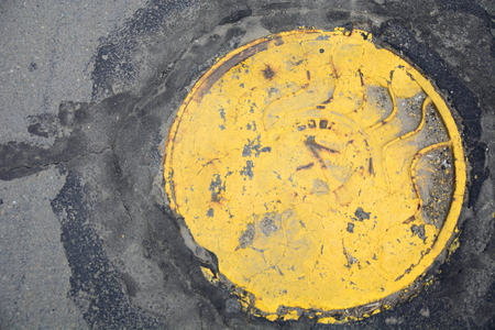the entrance to the sewers with yellow capの写真素材