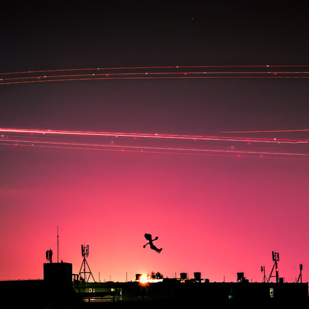 that unreal imagine happy-girl wallpaper or home screen jump in the air over the telecommunication  above light of airplaneの写真素材