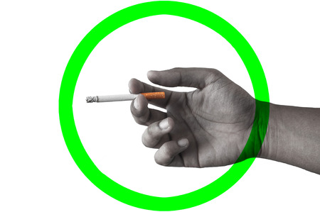 Handing cigarette by asia people that sign mean can smoke in the areaの写真素材