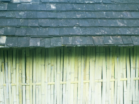 Bamboo wall with old roof.の写真素材