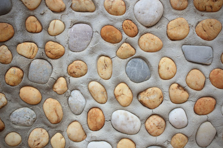 background made of a closeup of a wall with pebbles