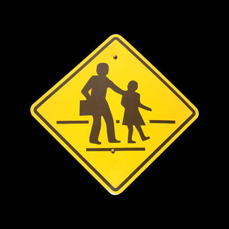 Caution School Sign on black backgroundの写真素材