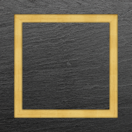 Wooden frame on black slate backgroundの写真素材