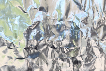 Silver foil with shiny surface for backgroundの写真素材