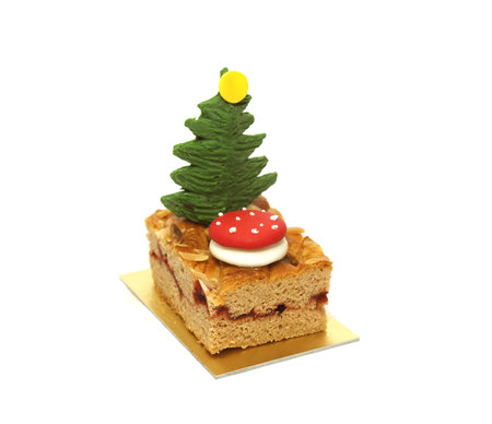Cake with Christmas tree isolated on white background.