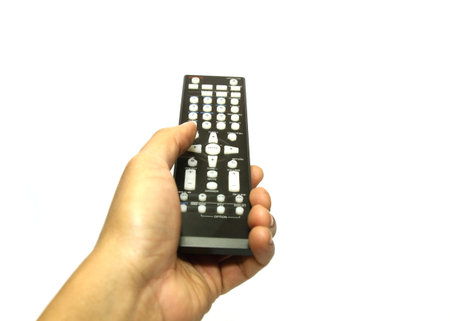 Hand with remote control isolated on white background